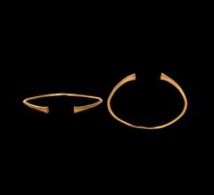 Antiquities - Celtic Iron Age Fine condition. Iron Age Celtic Gold Bracelet with Conical Terminals 2nd century BC-1st century AD. A slender round-section penannular bracelet with trumpet-shaped termin