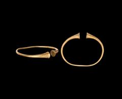 Antiquities - Celtic Iron Age Fine condition. Iron Age Celtic Gold Bracelet with Trumpet Terminals 2nd century BC-1st century AD. A slender round-section penannular bracelet with trumpet-shaped termin