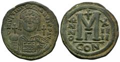 Coins - Byzantine Ancient Byzantine Coins - Justinian I - Large M Follis. 527-565 AD. Constantinople mint, year 14. Obv: D N IVSTINIANVS PP AVG legend with helmetted and cuirassed bust facing holding 