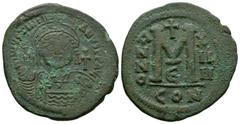 Coins - Byzantine Ancient Byzantine Coins - Justinian I - Large M Follis. 527-565 AD. Constantinople mint, year 14. Obv: DN IVSTINIANVS PP AVG legend with helmeted and cuirassed bust facing, holding c