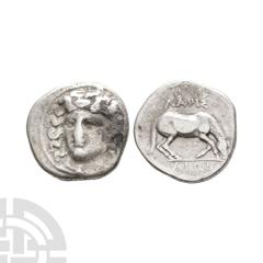 Coins - Greek Thessaly - Larissa - Horse AR Drachm. 400-380 B.C. Obv: facing head of the nymph Larissa, turned slightly to the right, wearing ampyx, drop earrings, and a necklace with a central pendan