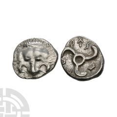 Coins - Greek Puresi - Lycia - Triskeles AR 1/3 Stater 380-360 B.C. Obv: facing lion's scalp. Rev: Lycian script PYRESI around triskeles rotating left, all within incuse square. Traité II 490. 2.83 gr