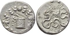 LYDIA. Tralleis. Cistophor (Circa 166-67 BC). Obv: Cista mystica with serpent; all within ivy wreath. Rev: Two serpents entwined around bow and bowcase; monogram above, poppy and grain ear to right. K