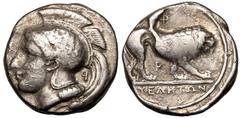MAGNA GRAECIA. LUCANIA, VELIA. Silver didrachm, circa 340-334 BC. Obv: head of Athena left, wearing crested Attic helmet decorated with griffin; P(retrograde) behind neck. Rev: lion advancing right; Φ