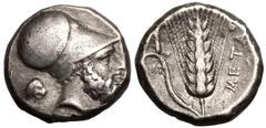 MAGNA GRAECIA. LUCANIA, METAPONTION. Silver Nomos, circa 340-330 BC. Obv: head of Leukippos right, wearing Corinthian helmet; head of lion behind, monogram below chin. Rev: ear of barley with leaf to 