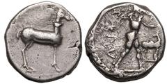 MAGNA GRAECIA. BRUTTIUM, KAULONIA. Silver Nomos, circa 475-425 BC. Obv: Apollo, nude, advancing right, holding branch in uplifted right hand, small daimon running right on outstretched left arm; KAV d