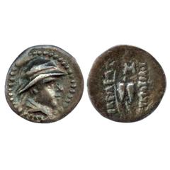 Ancient India. Indo-Greek, Eucratides (c. 170-145 BC), Silver obol, BN series 9, 0.58g. Obv: helmeted bust of the king; Rev: Two 'pilloi' caps and Greek legend Basileos Eukratidou.