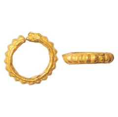 Ancient India. Ancient Indian ear ornament (2nd-3rd Century AD), Lead core clad in Gold, serrated and striated scalloped shape, 9.32g.