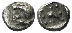 A selection of fractions and Arabian coins Ionia, Miletos, late 6th-early 5th century BC, Tetartemorion, 0.25g, 5mm. Head of roaring lion left / Eagle standing left; six pellets around; all within inc
