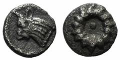 Greek Ionia, Erythrai(?), c. 480-450 BC, Tetartemorion, 0.09g, 4mm. Rosette with central pellet / Bull's head left. Very Fine, Extremely rare. Unpublished in the standard references.
