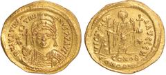 Ancient Coins, Byzantine, Justinian I (AD 527-565), gold solidus, Constantinople mint, DN IVSTINIANVS PP AVI, helmeted and cuir. bust facing, holding globe surmounted by cross, rev. VICTORIA AVGGG fol