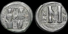 Byzantine BYZANTINE EMPIRE. Justin II, with Sophia. 565-578. Æ follis. 15.06 gm. 31 mm. Theoupolis (Antioch) mint, 3rd officina. Dated RY 7 (571/572). Justin and Sophia seated facing on double throne,