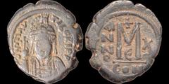 Byzantine BYZANTINE EMPIRE. Maurice Tiberius. 582-602. Æ follis. 11.46 gm. 28 mm. Constantinople mint, 5th officina. Year 10 (591-592). His helmeted and cuirassed bust facing, holding shield and globu