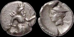 Greek PERSIAN EMPIRE. Circa 350 BC (Artaxerxes III). AR tetartemorion. .17 gm. 6 mm. Of uncertain mint. The great king running right / Head of Hermes left. Cf Brindley 447. Extremely Fine; even light 