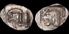Greek MYSIA. Kyzikos. Circa 525-475 B.C. AR hemiobol. .35 gm. 11 mm. Forepart of running boar left, tunny fish upwards behind / Head of roaring lion left, star to upper left, all within incuse square.