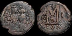 Byzantine BYZANTINE EMPIRE. Justin II. 565-578. Æ follis. 15.6 gm. 29 mm. Constantinople mint, 1st officina. Regnal year 1 (565/6). Justin on left holding globus cruciger and Sophia on right holding c