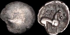 Celtic Britain CELTIC BRITAIN. North Eastern region. Corieltauvi, uninscribed silver. AR unit. 1.15 gm. 14 mm. Faint semblance of a boar / Horse right, eight pellets in a circular array with a central