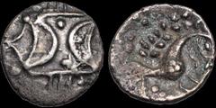 Celtic Britain CELTIC BRITAIN. East Anglian Region, Iceni. Ecen. Circa A.D. 10-43(?). AR unit. 1.03 gm. 13 mm. Double crescent symbol over a vertical wreath / Horse right with a pellet eye, S below he