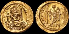 Byzantine BYZANTINE EMPIRE. Justinian I. 527-565. AV solidus. 4.48 gm. 20 mm. Constantinople mint. Struck 542-552. His helmeted and cuirassed bust facing, holding globus cruciger and shield / Angel st