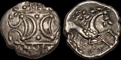 Celtic Britain CELTIC BRITAIN. Iceni. Inscribed (Ece). Circa A.D. 10-43(?). AR unit. 1.24 gm. 12 mm. Two crescents on vertical wreath / Horse stepping right, head facing, pelleted sun above; ECE below