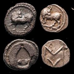 Magna Graecia Lucania. Sybaris. Pair of Fractional Silver: Obol, ca. 550-510 BC. 0.41 gms. Bull standing left, head reverted, VM in ex., rev. Large MV, four pellets around (three off flan). SNG ANS 85