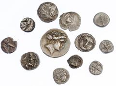 Ancient Coins A Dozen AR Fractions of North and Central Greece. Ca. Fourth-Third Century BC. Celtic. Obol, laureate head/Zeus enthroned; Istros. Hemiobols (2), two male heads/Eagle; Apollonia Pontika.