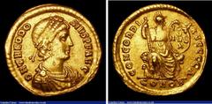 Ancient Coins Theodosius I. Au solidus. C, 383-388 AD. Constantinople. Rev; CONCORDIA AVGGGA; Constantnopolis std r hldg shield inscribed VOT V MVL X; CONOB in ex. 4.44g. NVF