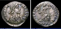 Ancient Coins Ar Siliqua. Honorius. C, 393-423 AD. Rev; VIRTVS ROMANORVM, Roma seated facing on throne, head left, holding globe and reversed spear, MDPS in ex. RIC 1228. Cabinet tone. 1.17g. N EF.