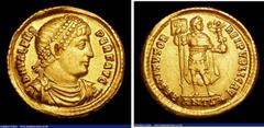 Ancient Coins Au solidus. Valens. C, 364–378 AD. Antioch .Obv; Pearl diademed, draped and cuirassed bust right DN VALENS PER F AVG. Rev. Valens standing with head right, holding labarum and Victory RE