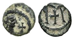 Vishigothic Coins / Monedas Visigodas Nummus. s. VI. Toledo. (Cru-Group D, Type 44). Anv.: Bust on the right, in front of the cross and around the edge. Rev.: Monogram formed by two vertical lines fro