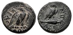 Roman Imperial Phrygia. Synnada. AE 14. 14-37 AD. Time of Tiberius. (RPC-3184). Anv.: Eagle, with head left and wings spread, standing right. Rev.: Owl, with head facing, standing right on amphora rig