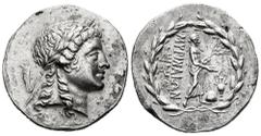 Greek Coins Aeolis. Myrina. Tetradrachm. 155-145 BC. Stephanophoric type. (Sacks-issue 42). Anv.: Laureate head of Apollo right. Rev.: Apollo Grynios standing right, holding branch and phiale; monogra