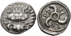 Greek DYNASTS OF LYCIA. Vekhssere II, circa 410-390/80 BC. 1/3 Stater (Silver, 17 mm, 3.07 g). Facing lion's scalp. Rev. 𐊇𐊀-𐊜𐊖-𐊖𐊁 ('Waxsse' in Lycian) Triskeles with central ring of dots; within