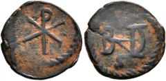 Medieval & Islamic MEROVINGIANS. Royal Issues. Theudebert I, king of Austrasia , 534-548. Nummus (Bronze, 14 mm, 1.29 g, 5 h), Marseille, after 536. Christogram within wreath. Rev. Monogram of Theudeb