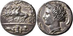 Greek SICILY. Syracuse. Dionysios I, 405-367 BC. Dekadrachm (Silver, 35 mm, 42.63 g, 12 h), signed by Euainetos, circa 405-400. Charioteer driving quadriga galloping to left, holding kentron in his ri