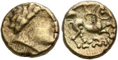 Celtic NORTHWEST GAUL. Carnutes. Circa 100-50 BC. Quarter Stater (Electrum, 10 mm, 1.69 g, 9 h), 'à la branche fleurie' type. Celticized laureate head of Apollo to right. Rev. Devolved charioteer ridi