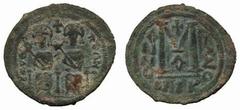 Byzantine No.: 250 Estimate: £ 350.- Arab-Byzantine, after 641, Follis, Scythopolis, CKYQO-POLHC, seated emperor and empress in style of Justin II and Sophia, rev large M flanked by ANNO and cursive f