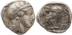 Greek coins Attique, Athènes - Tétradrachme A/ Tête d'Athéna à droite coiffée du casque attique à cimier. R/ Dans un carré creux, une chouette debout à droite avec la tête de face. A gauche, une branc