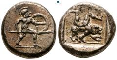 Greek Pamphylia. Aspendos circa 465-430 BC. Stater AR 21mm., 10,93g. Warrior advancing right, holding shield with left hand and spear with right / Triskeles, [E]-Σ Π above, below, lion standing right,