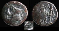 Hellenistic Kingdoms KINGS OF MACEDON: Antigonos III Doson, 229-221 BCE, AE19. 4.08g, 18mm. Obv: Helmeted head of Athena right. c/m: prow Rev: Pan right, erecting trophy to right; B-A across upper fie