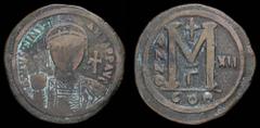 Byzantine & Crusader Justinian I (527-565) AE follis, issued 538/9 (year 12). Constantinople, 20.19g, 40mm. Obv: D N IVSTINIANVS P P AVI; Diademed, helmeted and cuirassed bust facing, holding globus c