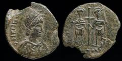 Roman Imperial Theodosius II (402-450) AE Maiorina. Cherson, 4.15g, 23mm. Obv: D N THEODOSIVS P F AVG; helmeted, diademed and draped bust right, holding shield on left arm and spear facing forwards Re