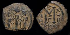 Byzantine & Crusader ARAB-BYZANTINE, Rashidun Caliphate, AE fals, c. 637-643, Imitating a follis of Cyprus. Uncertain mint in Syria, 4.40g, 26mm. Obv: Three imperial figures standing facing, each wear