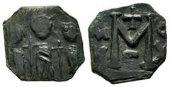 Byzantine Coins Heraclius with Heraclius Constantine, and Martina, 610-641 AD. AE Follis - 40 Nummi (16mm, 1.97g). Uncertain mint in Cyprus. Heraclius, in center, flanked by Martina, on left, and Hera