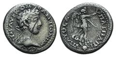 Roman Provincial Commodus (177-192). Cappadocia, Caesarea-Eusebia. AR Didrachm (20mm, 4.11g, 12h). AD 183-6. Laureate head r. R/ Nike standing r. on globe, holding palm frond and wreath; Δ in legend. 