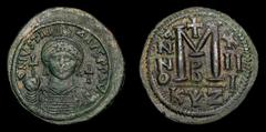 Islamic Coins Byzantine Empire Justinian I, AE Follis (40 Nummi). Cyzicus. 527-565 AD. DN IVSTINIANVS PP AVG, helmeted, cuirassed bust facing, holding cross on globe and shield with horseman motif, cr