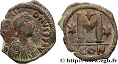 Byzantine coins JUSTINIAN I Type : Follis  Date : 527-537  Mint name / Town : Constantinople  Metal : copper  Diameter : 35,5  mm Orientation dies : 6  h. Weight : 16,63  g. Rarity : R1  Officine : 4e