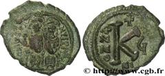 JUSTIN II(15/11/565-5/10/578) Demi-follis N° v31_0709    Date : 570-571 Nom de l'atelier : Nicomédie Métal : cuivre Diamètre : 23mm Axe des coins : 12h. Poids : 6,84g. Degré de rareté : R1 Etat de con