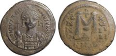 Byzantine Coins JUSTINIAN I (527-565). Follis. Nicomedia. Obv: D N IVSTINIANVS P P AVG. Helmeted and cuirassed facing bust, holding globus cruciger and shield; cross in right field. Rev: Large M betwe