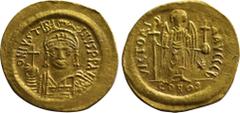 Byzantine Coins JUSTINIAN I (527-565). GOLD Solidus. Constantinople. Obv: D N IVSTINIANVS P P AVG. Helmeted and cuirassed bust facing, holding globus cruciger and shield decorated with horseman motif.